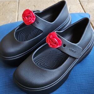 CROCS Black Mary Jane with Red Flower Accent.